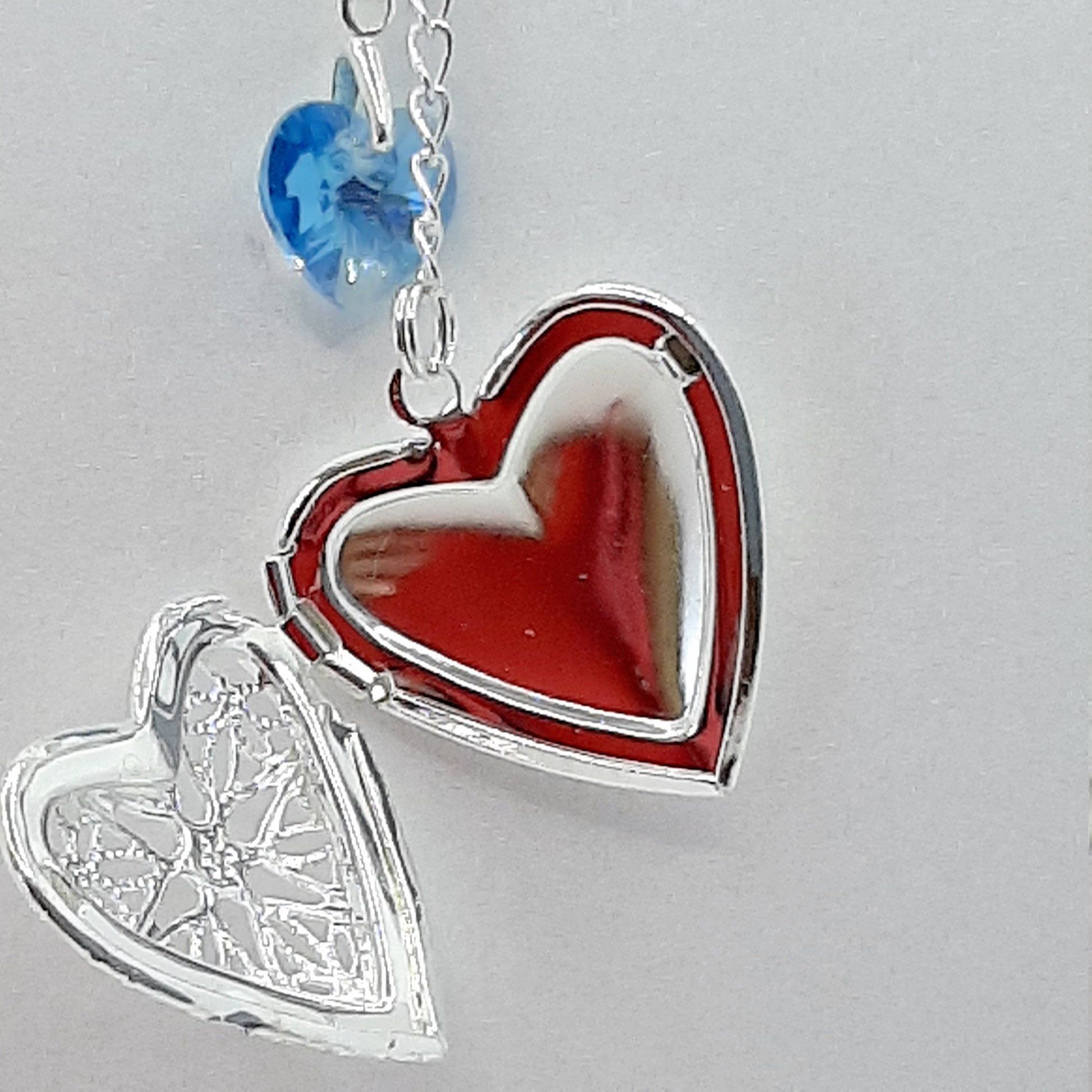 Memorial locket open and with blue crystal heart