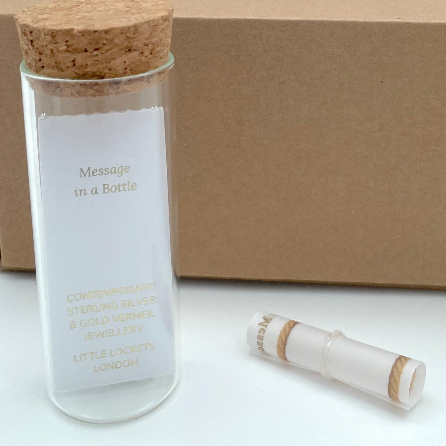 Reverse of Message in a Bottle jewellery showing card and scroll