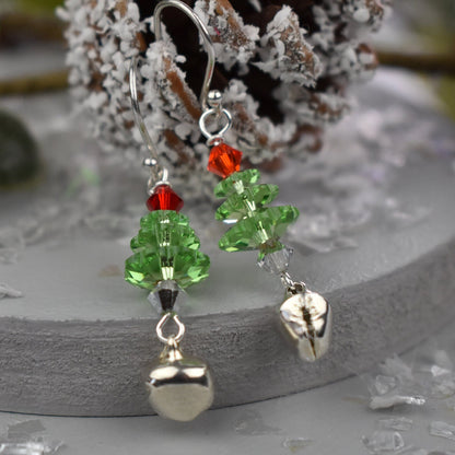 Christmas tree earrings made from high quality crystals, green Christmas tree is topped with a red crystal . Real jingle bell is suspended from each tree. Hung on sterling silver ear wires.