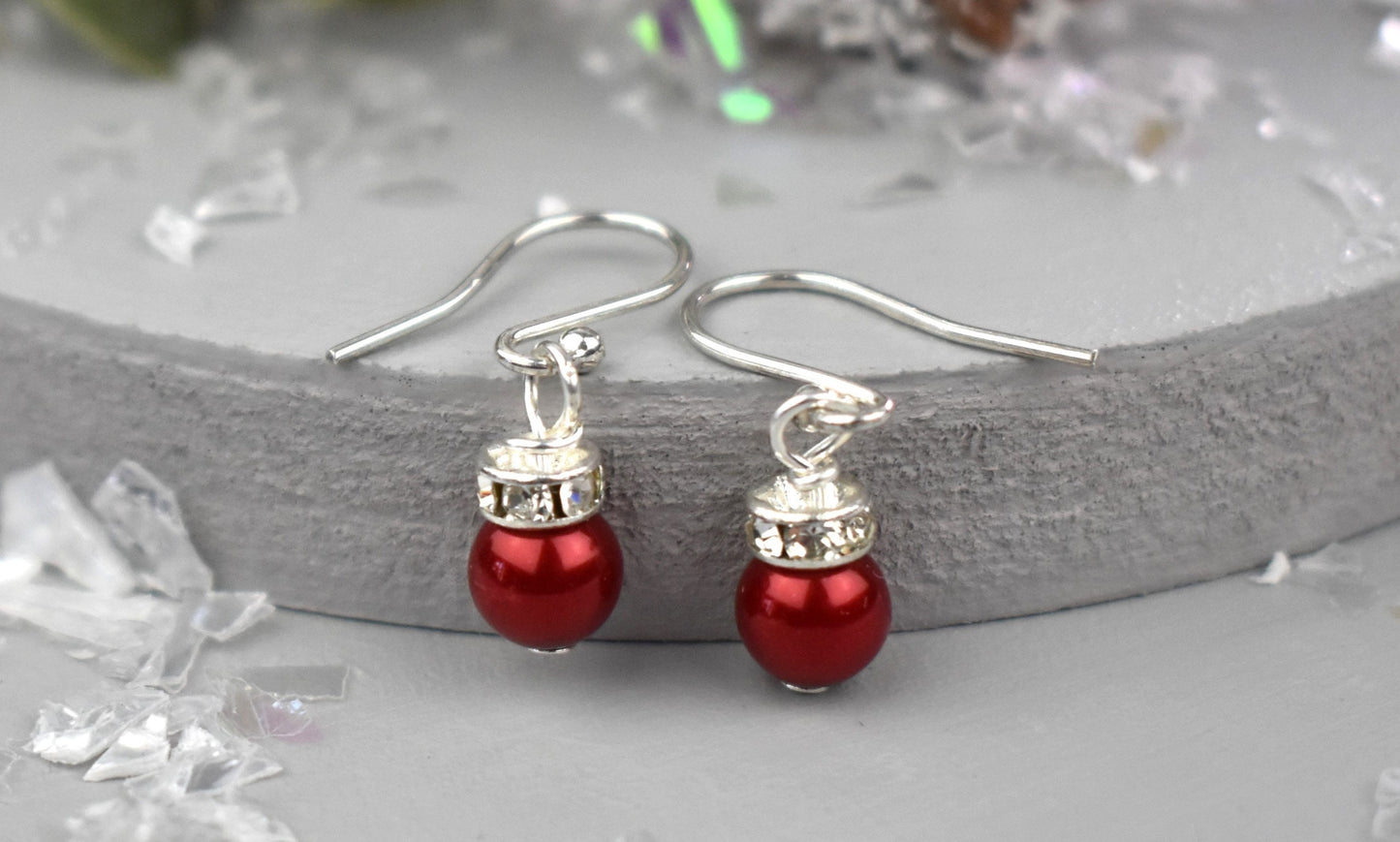 High quality glass pearl topped with a silver sparkling rondell bead and suspended from sterling silver ear wires. Christmas bauble earrings.