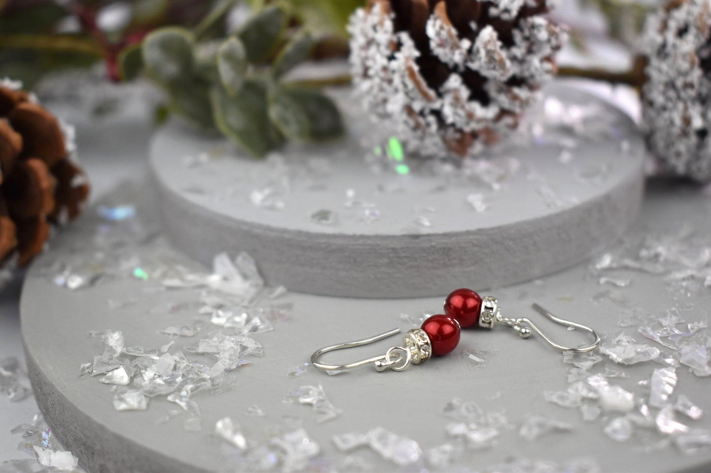 High quality glass pearl topped with a silver sparkling rondell bead and suspended from sterling silver ear wires. Christmas bauble earrings.