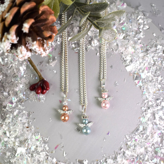 Snow angel pendant in variety of glass pearl covers, two glass pearls with angel wings and halo on silver plated chain.