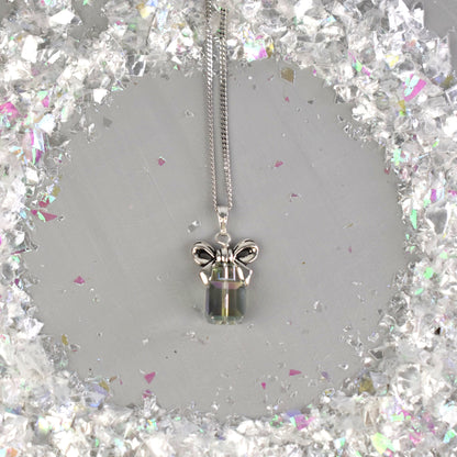 Christmas present stack pendant shown in Vitrail crystal colour. Topped with a silver bow and suspended from an 18 chain. 