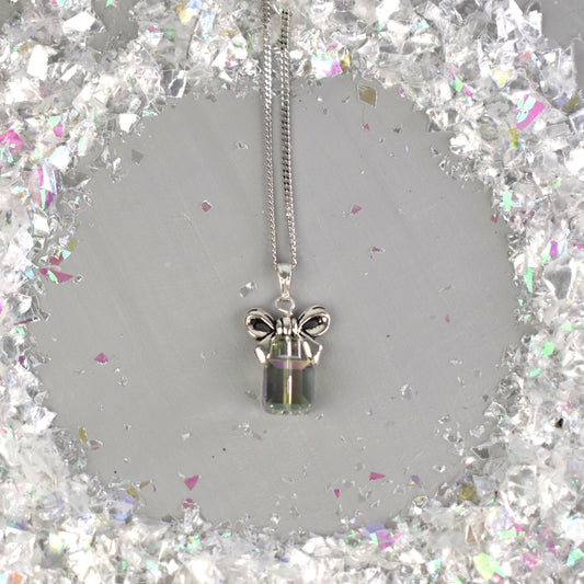 Christmas present stack pendant shown in Vitrail crystal colour. Topped with a silver bow and suspended from an 18 chain. 