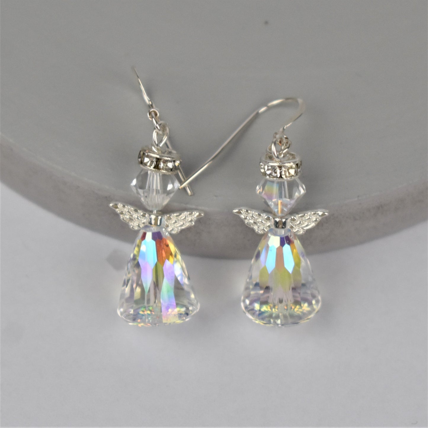 Crystal angel earrings hung from sterling silver wires, made with high grade Austrian crystal