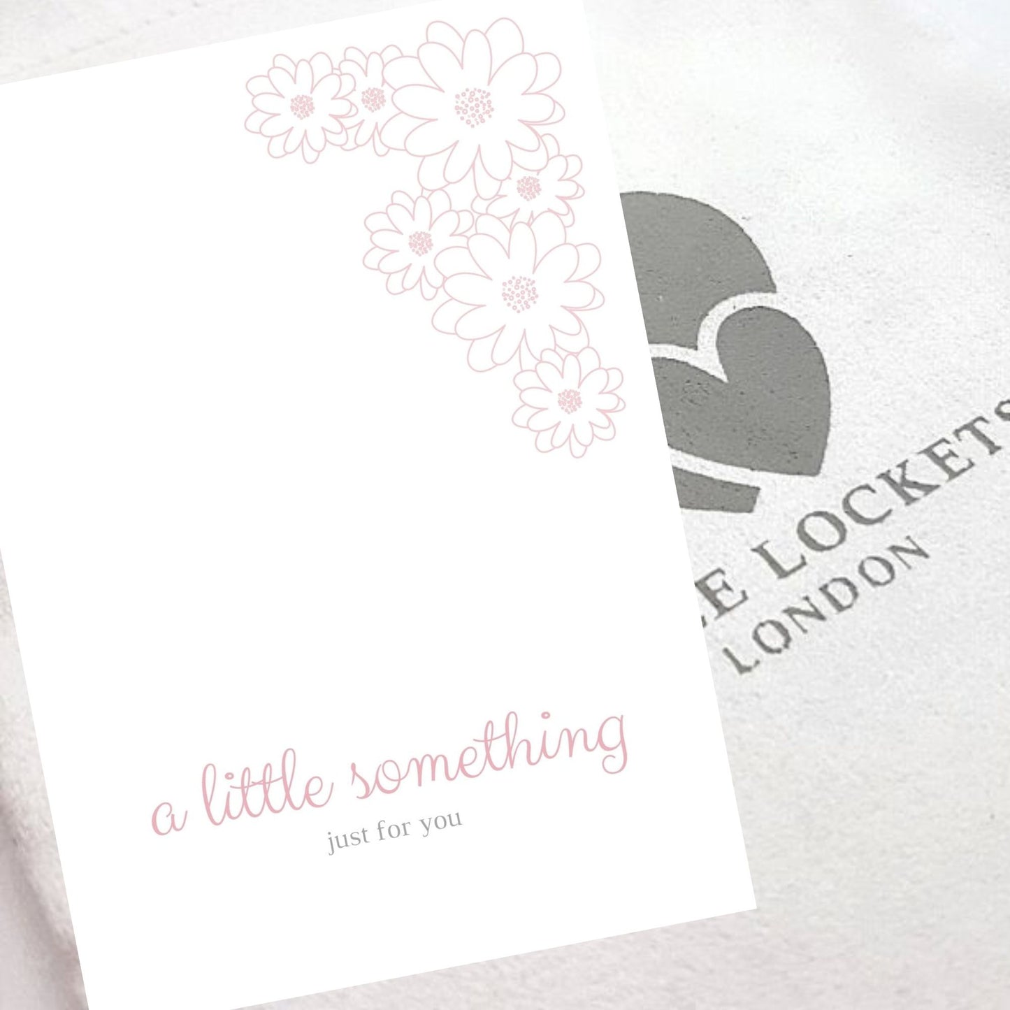 Gift card "A little something just for you" shown with luxury gift pouch